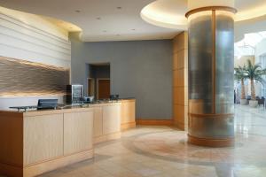 a lobby with a large column in a building at Sheraton Myrtle Beach in Myrtle Beach