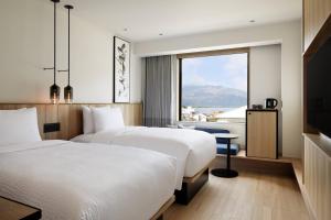 Tempat tidur dalam kamar di Fairfield by Marriott Kyoto Amanohashidate