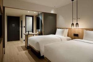 Tempat tidur dalam kamar di Fairfield by Marriott Kyoto Amanohashidate