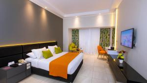 A bed or beds in a room at Naama Bay Suites & SPA