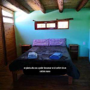 A bed or beds in a room at Reposo del Huasamayo