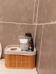 a wooden container with a toilet in a bathroom at Mini studio aproape de centru in Bucharest