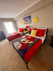 a bedroom with two beds in a room at Mario, Harry Potter & Disney Loft Universal Studios 10min loft apartment in Los Angeles