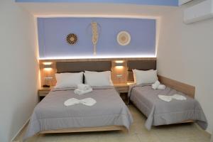 Cama ou camas em um quarto em Denis Hotel and Bungalows