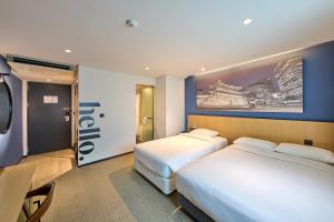 Cama ou camas em um quarto em Travelodge Myeongdong City Hall