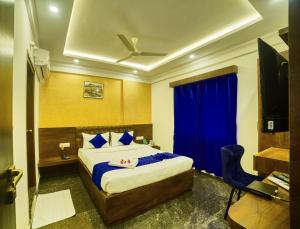 מיטה או מיטות בחדר ב-SM Royal Stay Hotel - Near Bangalore international Airport