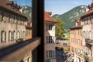 een uitzicht vanuit een raam van een stad met gebouwen bij Annecy Historical Center - 165 square meter - 3 bedrooms & 3 bathrooms in Annecy