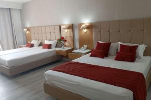 A bed or beds in a room at Djerba Holiday Beach