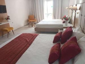 A bed or beds in a room at Djerba Holiday Beach