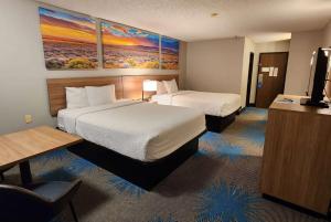 Tempat tidur dalam kamar di Days Inn by Wyndham Tucumcari