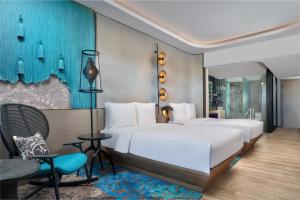 Tempat tidur dalam kamar di Renaissance Bali Nusa Dua Resort