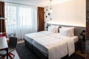 Säng eller sängar i ett rum på Pentahotel Bremen