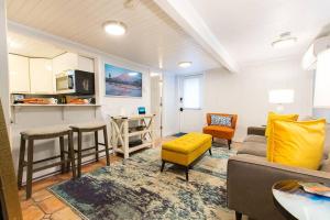 a living room with a couch and a table at Condo with Wading Pool Dog Welcome in Provincetown