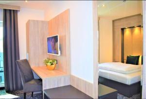 מיטה או מיטות בחדר ב-Hotel Business Bay das ehemalige Staycation Hotel