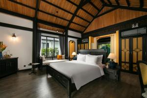 Posteľ alebo postele v izbe v ubytovaní Bliss Hoi An Beach Resort & Wellness