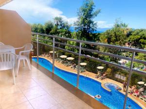 a view from the balcony of a hotel with a swimming pool at Aparthotel SunClub Salou in Salou