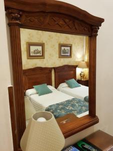 Cama ou camas em um quarto em Hotel Europa Boutique Sevilla