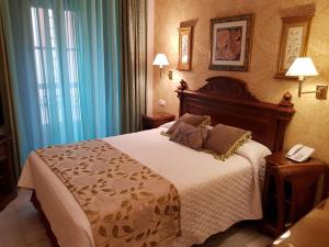 Cama ou camas em um quarto em Hotel Europa Boutique Sevilla