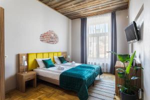 Ліжко або ліжка в номері Aparthotel Pergamin