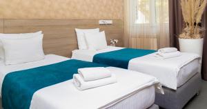 Кровать или кровати в номере Garni Hotel Mint