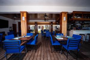 A restaurant or other place to eat at Blue Skies Beach Resort