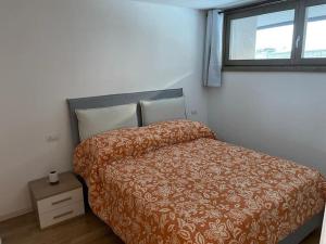 Una cama o camas en una habitación de Appartamento nuovo tra Bormio e Livigno