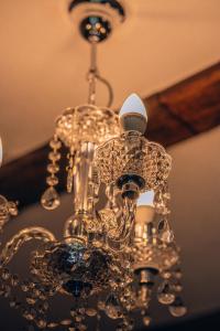 a chandelier hanging from a ceiling at Willa Skalniak in Lądek-Zdrój