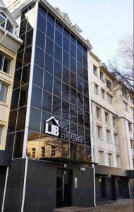 a large building with the words he house on it at Moldova Balți center in Bălţi