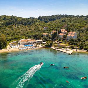 an aerial view of a beach with boats in the water at TUI BLUE Kalamota Island - Adults Only in Dubrovnik