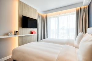 Katil atau katil-katil dalam bilik di Holiday Inn Express Antwerp - City Centre, an IHG Hotel