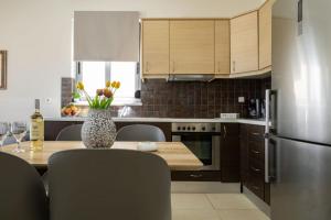 Una cocina o kitchenette en Christini Cozy Apartment