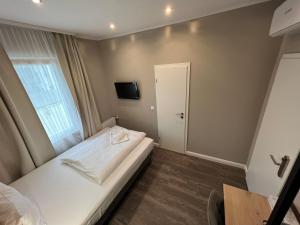 Postel nebo postele na pokoji v ubytování JJ Hotel Hannover-City-Pension