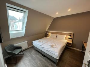 Postel nebo postele na pokoji v ubytování JJ Hotel Hannover-City-Pension