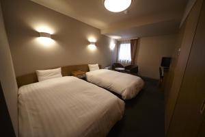 เตียงในห้องที่ Dormy Inn Express Sendai Hirose Dori