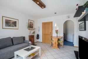 a living room with a couch and a table at Ferienwohnung Schläfer in Kappel-Grafenhausen