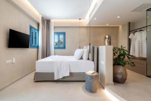 Vuode tai vuoteita majoituspaikassa Aura Suites Paros