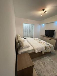 Ліжко або ліжка в номері Apartament regim hotelier