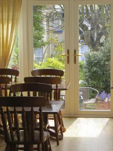 a group of chairs sitting in front of a door at Seaclyffe Hotel Ltd in Llandudno