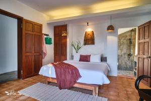 Giường trong phòng chung tại Pao Homes - An Hai Villa, Family-Friendly Villa with Pool