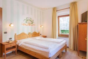 Krevet ili kreveti u jedinici u objektu Hotel Miralago Wellness - Adults Only