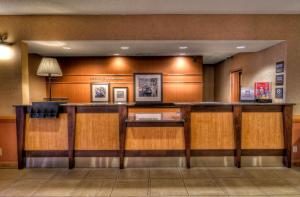 a lobby with a bar in a hotel at Hampton Inn & Suites Kalamazoo-Oshtemo in Oshtemo