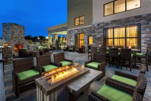 a patio with chairs and a fire pit at Hampton Inn & Suites Williamsport - Faxon Exit in Williamsport