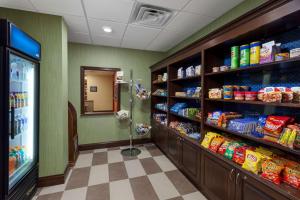 a grocery store aisle with shelves of food at Hampton Inn & Suites Williamsport - Faxon Exit in Williamsport