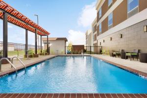 The swimming pool at or close to Home2 Suites By Hilton Baton Rouge