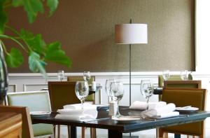 a black table with glasses and napkins on it at DoubleTree by Hilton Southampton in Southampton