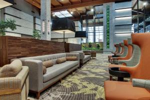 a lobby with couches and chairs in a building at Doubletree By Hilton Mt. Vernon in Mount Vernon