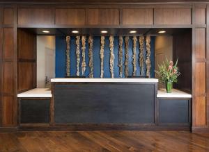 a lobby with a reception desk in a building at Jamaica Bay Inn Marina Del Rey Tapestry Collection by Hilton in Los Angeles