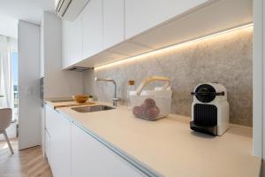 A kitchen or kitchenette at Hauzify I Loft Ancora