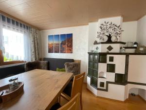 a dining room with a wooden table and chairs at Sun Chalet in Schladming