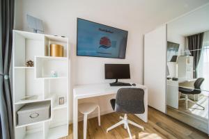 TV i/ili multimedijalni sistem u objektu Sunset Apartment